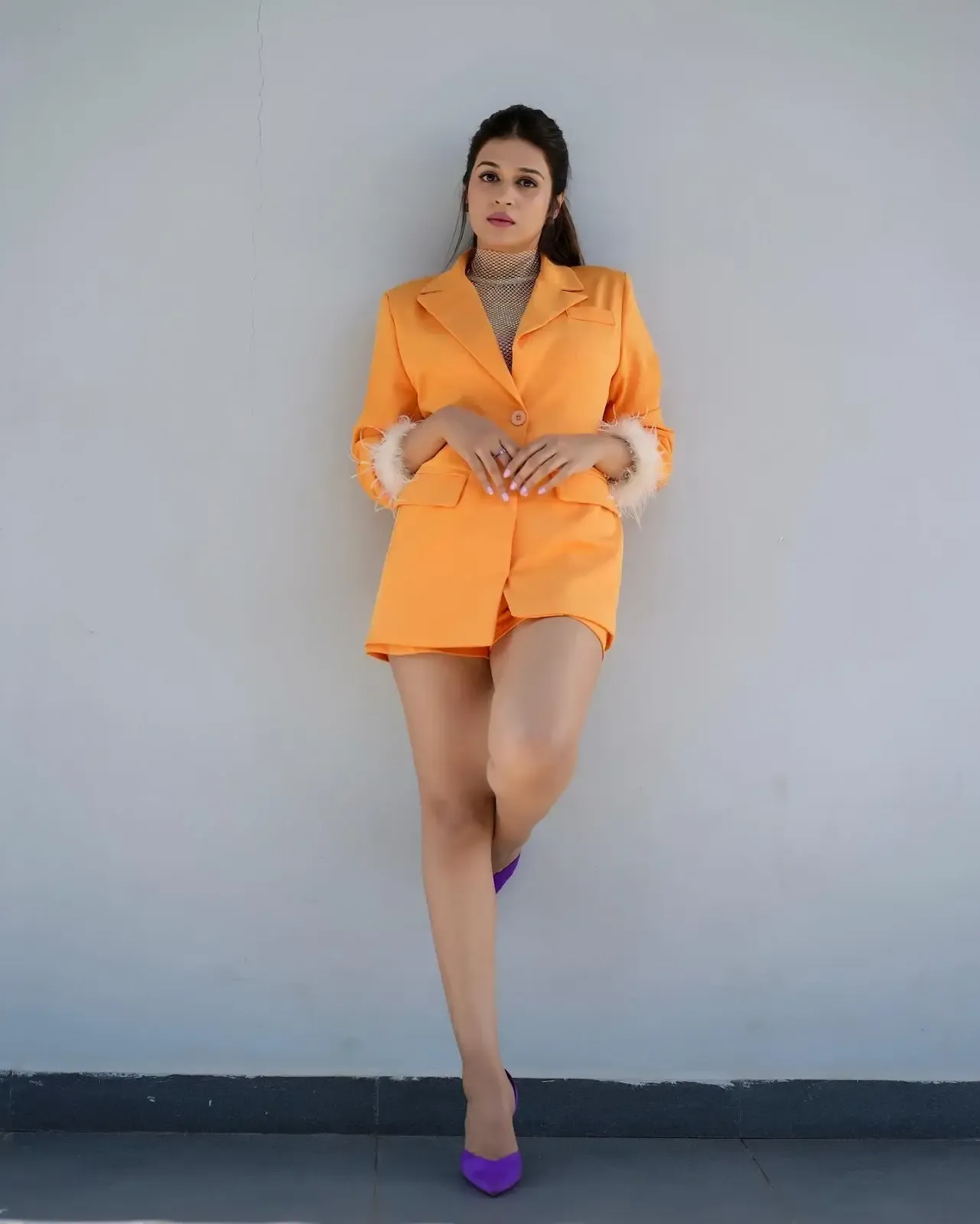 Actress Shraddha Das Long Legs Show in Mini Orange Top